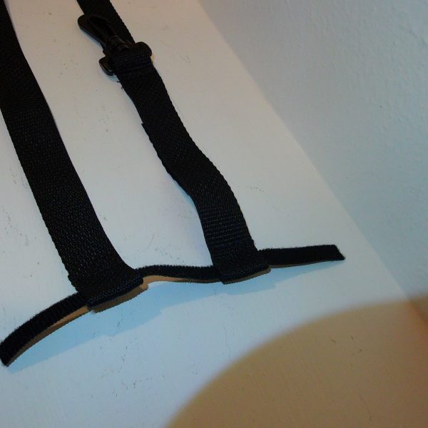 3. velcro loop fastens the strap to the radio clip